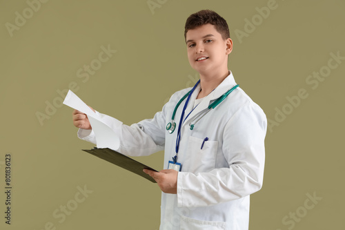 Teenage doctor with clipboa...