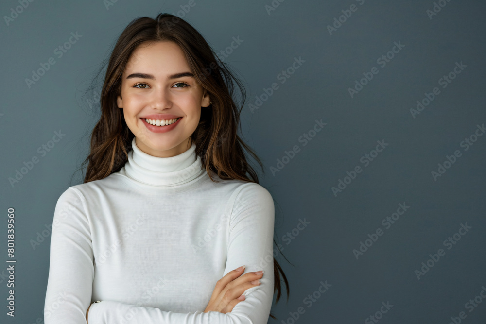 Portrait of happy smiling woman in white turtleneck sweater standing with arms crossed looking at camera over isolated background Portrait of happy smiling woman in white turtleneck sweater standing with arms crossed looking at camera over isolated background