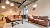 Exposed brick walls, concrete floors, leather sofas, and metal accents, Vintage signage, salvaged wood coffee table, Exposed bulb pendant lights