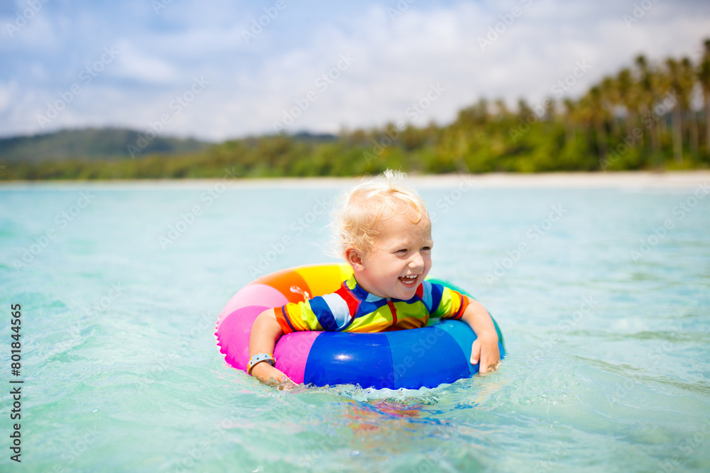 Child on tropical beach. Sea vacation with kids. Child on tropical beach. Sea vacation with kids.
