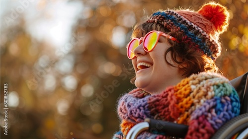 A young woman in an electric wheelchair wears colorful knitted sunglasses as seen from the side. Blurred background, Generative AI illustrations