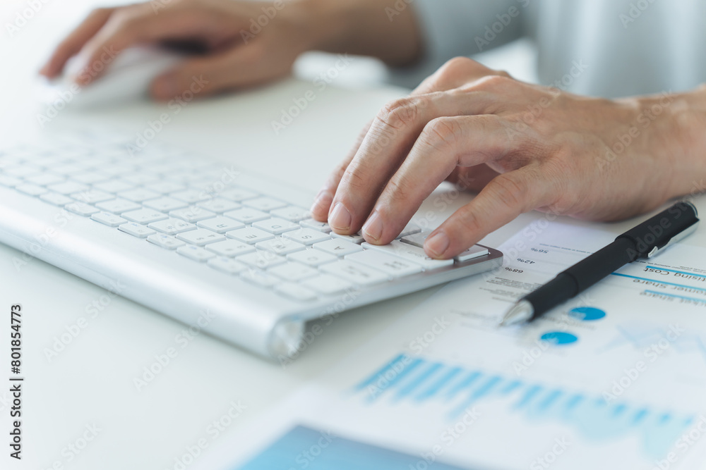 Businessperson working on laptop or computer with document. Businessman or analyst work with business marketing data and information. Financial analysis budget planner for management project. Businessperson working on laptop or computer with document. Businessman or analyst work with business marketing data and information. Financial analysis budget planner for management project.