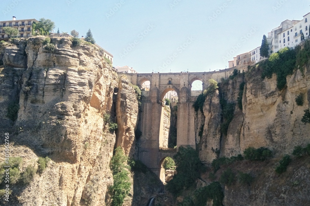 Puente Nuevo arch bridge over the tajo Gorge at Ronda village, Spain. Tourist viewpoint cliff in Ronda province of Malaga, Andalucia