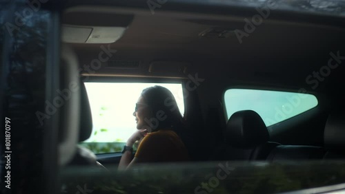 Wallpaper Mural Happy moment of young beautiful asian woman travel to the sea by car on a bright day. Vacation holiday weekend breathing fresh air and sticking her head out the windshield with beautiful blue sky. Torontodigital.ca