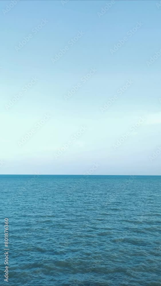 Sea wave and bright sky. Ocean ripple water vertical background. Summer seascape. Sea wave and bright sky. Ocean ripple water vertical background. Summer seascape.