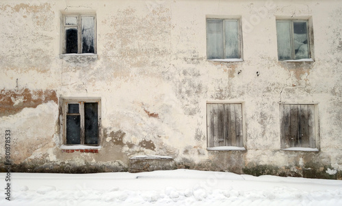 Abandoned ancient house in winter.