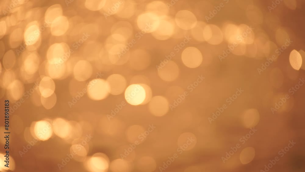 Abstract Blurred video screensaver bokeh golden sea at sunset. The sun reflects and sparkles on the waves. Abstract Blurred video screensaver bokeh golden sea at sunset. The sun reflects and sparkles on the waves.