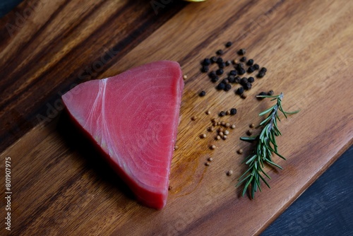 Tuna raw fish on wood plate  photo