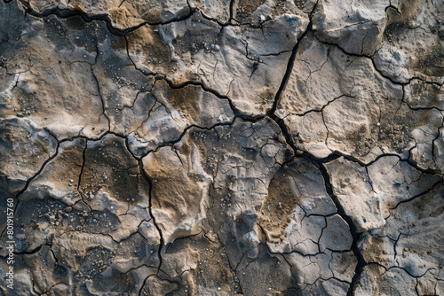 An aerial view of a dried-up riverbed after being washed away by the river, with a vast expanse of land.