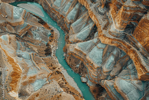 An aerial view of a dried-up riverbed after being washed away by the river, with a vast expanse of land.