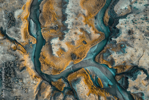 An aerial view of a dried-up riverbed after being washed away by the river, with a vast expanse of land.