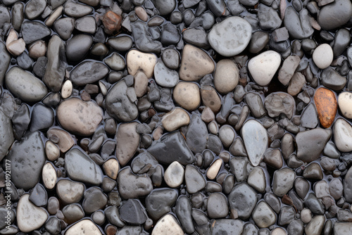 Processed collage of wet pebble stones on asphalt texture. Background for banner, backdrop