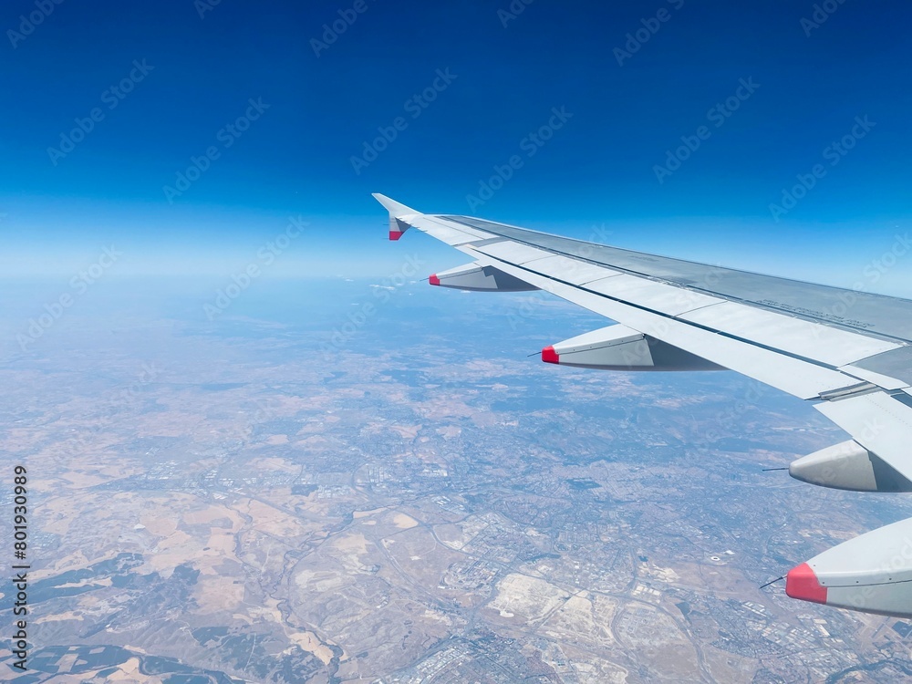 Fototapeta premium view from airplane window over Spain in Summer showing dry landscape