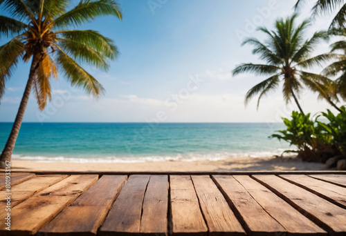 Top of wood table with seascape and palm tree  blur bokeh light of calm sea and sky at tropical beach background