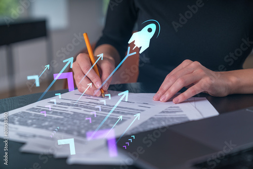 Businesswoman in formal wear taking notes signing contract at office workplace. Concept of important working moments, document sign, working process, concentration. Hands shot. Startup hologram