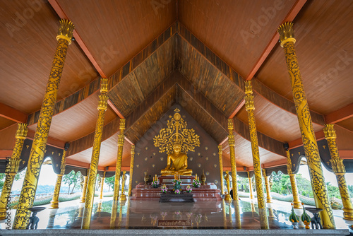 The gold Buddha in the Wat Sirindhorn Wararam or Wat Phu Prao, also known as the Glow Temple, is located in Sirindhorn, Ubon Ratchathani, Thailand