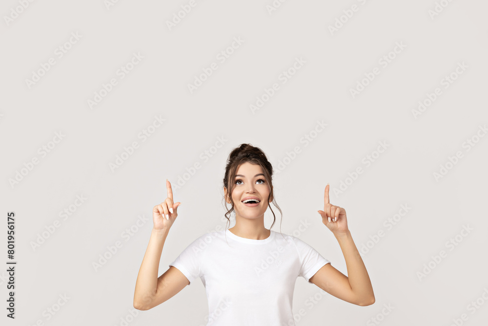Attractive young girl posing on a white background Attractive young girl posing on a white background