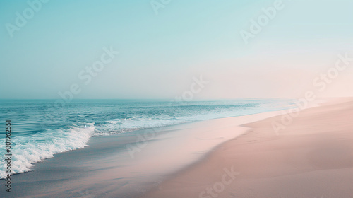 Beach scene at sunrise, waves lapping onto the smooth and undisturbed sandy shore, blue sky blending into the sea. photo