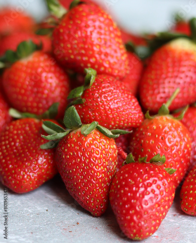Fototapeta Naklejka Na Ścianę i Meble -  Strawberry background. Juicy organic berries close up photo. Summer fruit texture. Fresh strawberries from above filling the frame