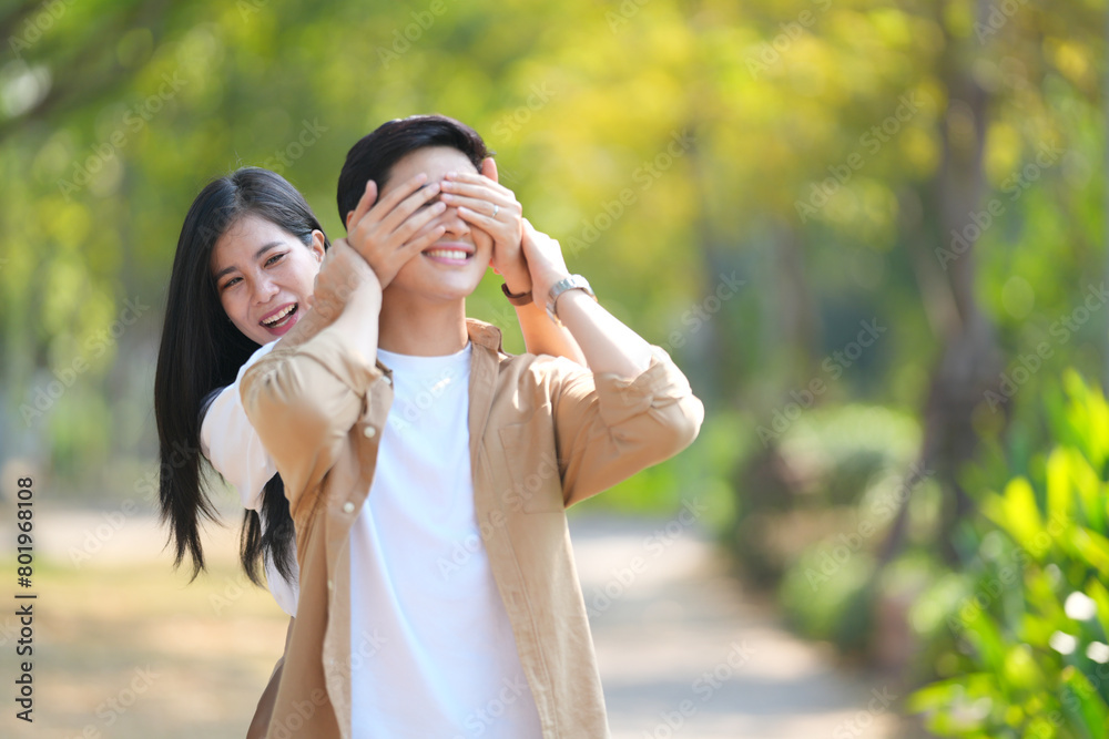 Beautiful young couple outdoors in the park. Portraits of lovers. Autumn. Spring. Holiday Valentine's Day. Beautiful young couple outdoors in the park. Portraits of lovers. Autumn. Spring. Holiday Valentine's Day.