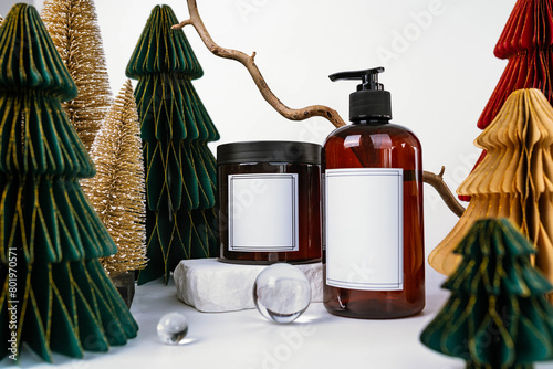 dark jar with lid and dispenser on the background of Christmas decorations, side view
