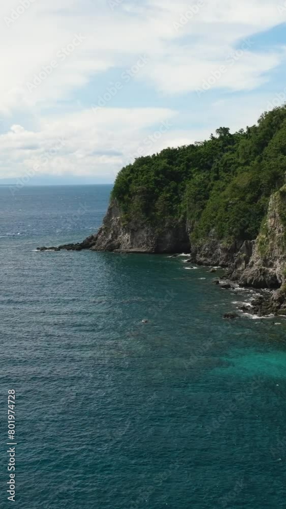 Rocky coast of a tropical island. Apo Island. Negros, Philippines. Rocky coast of a tropical island. Apo Island. Negros, Philippines.