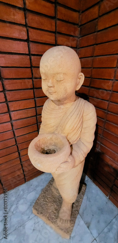 Buddhist novice statue