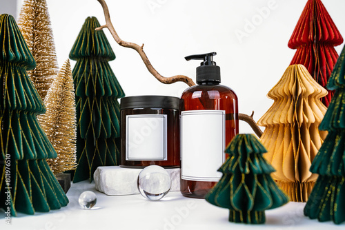dark jar with lid and dispenser on the background of Christmas decorations, side view