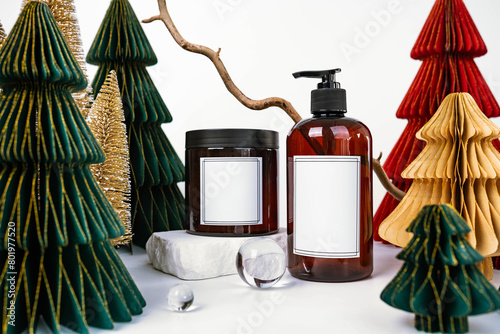 dark jar with lid and dispenser on the background of Christmas decorations, side view