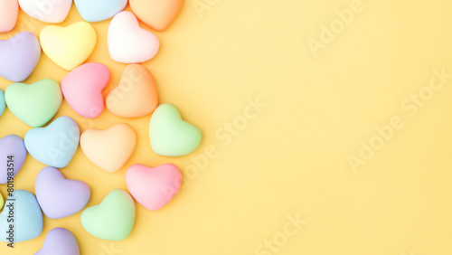 Colorfully heart jelly on a yellow background.