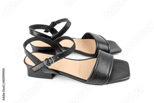 Black leather sandals. Stylish elegant trendy designer fashionable leather women's sandals shoes isolated. A pair of women's sandals isolated on a white background.