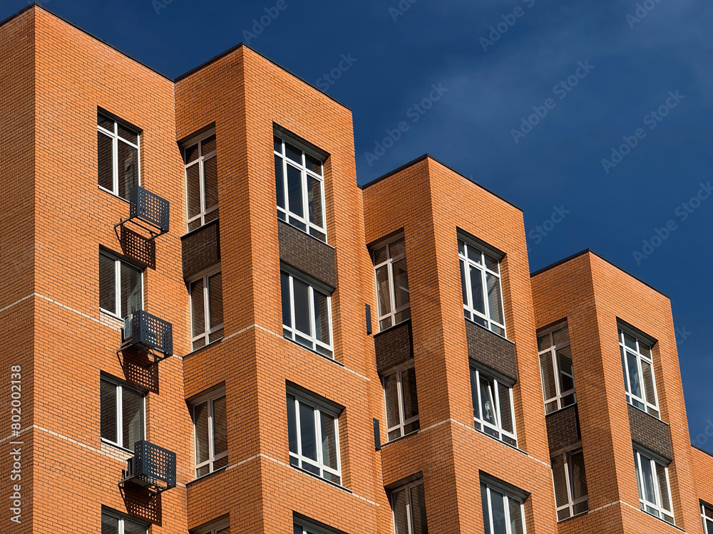 Fototapeta premium Apartments Building Towers. New building. The facade of the new residential high-rise buildings against the sky . The concept of building a typical residential neighborhood.