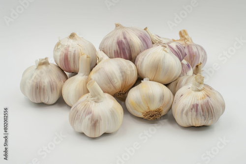 a pile of garlic on a white background