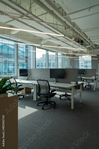 Interior of modern empty office building.Open ceiling design.Equipped with automatic lifting table and LCD screen.