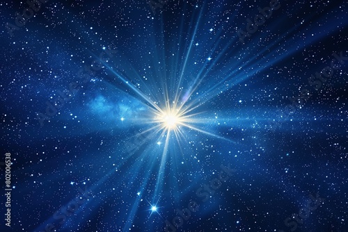 A mesmerizing deep blue canvas explodes with a radiant burst of starlight, casting rays in all directions.