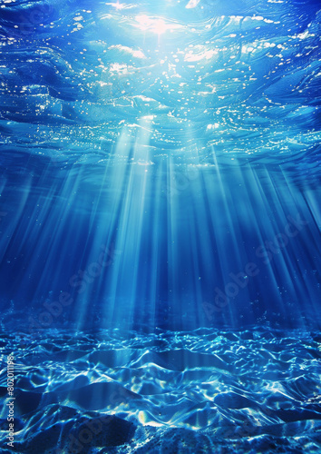 a blue ocean with sunlight shining through the water