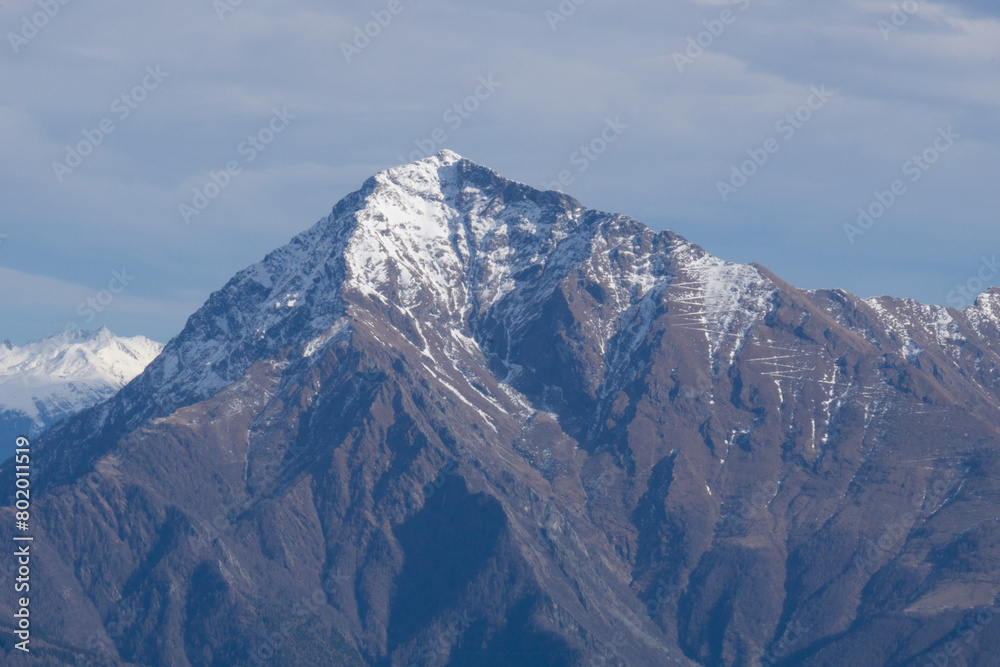 The mountains and landscape above Lake Como during a winter day, near the town of Tremezzo, Italy - December 24, 2023.
