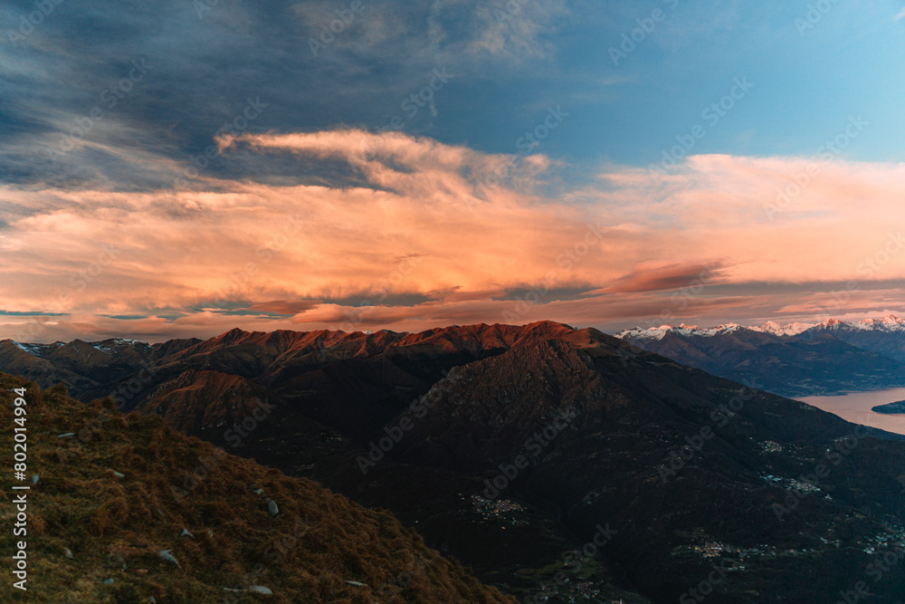 The lights and colors of the sunset on Lake Como, near the town of Tremezzo, Italy - December 24, 2023