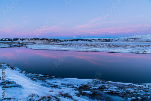 Iceland landscape with moon, snow, sky and water