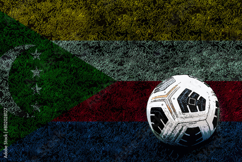 Football ball and field with Comoros flag, soccer ball and national flag, soccer cup idea, Comoros 