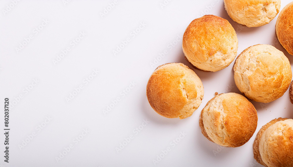 Freshly baked buttermilk biscuits on white table. Tasty cookies. Delicious snack. Homemade bakery. Freshly baked buttermilk biscuits on white table. Tasty cookies. Delicious snack. Homemade bakery.