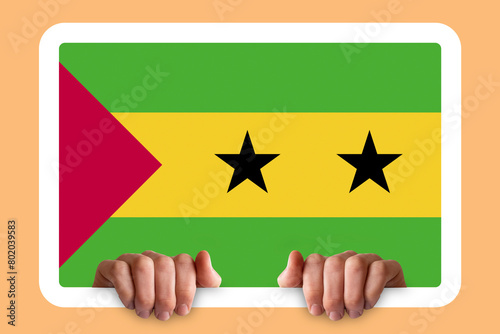 Hands holding a white frame with Sao Tome And Principe flag, protest or social issues in Sao Tome 