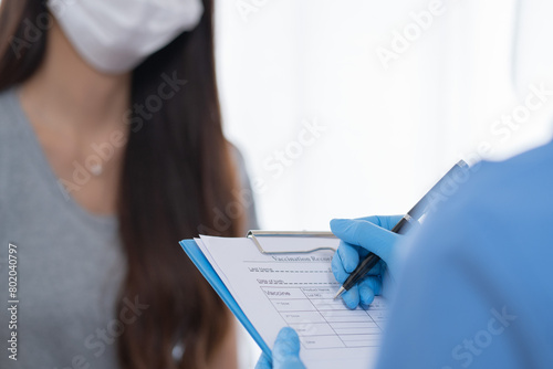 Nurse take patient history and make appointment with patient before inject or jab the vaccine to immune illness with checklist sheet and examination sheet photo