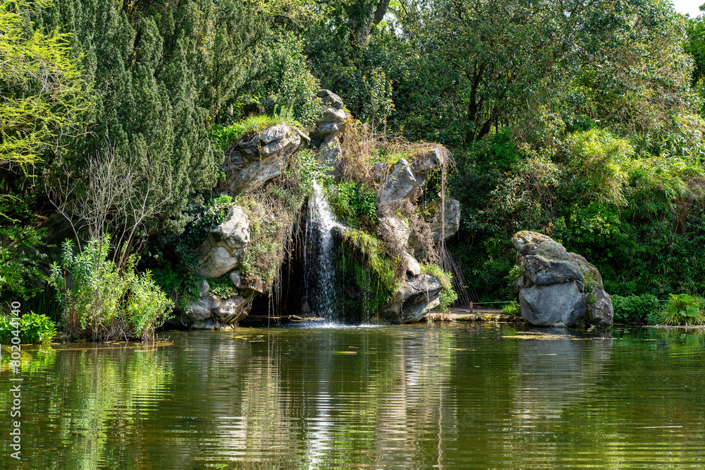 Pond and Cascade in the Bagatelle Park at springtime. The Park is located in Boulogne-Billancourt near Paris, France Pond and Cascade in the Bagatelle Park at springtime. The Park is located in Boulogne-Billancourt near Paris, France