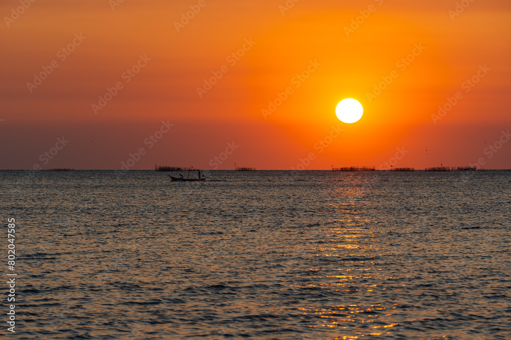 Sunset over the sea background. Big sun over the sea with beautiful natural light at sunset or sunrise. Sunset over the sea background. Big sun over the sea with beautiful natural light at sunset or sunrise.