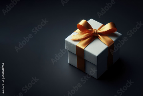 Holiday gift on dark background. Space for text.