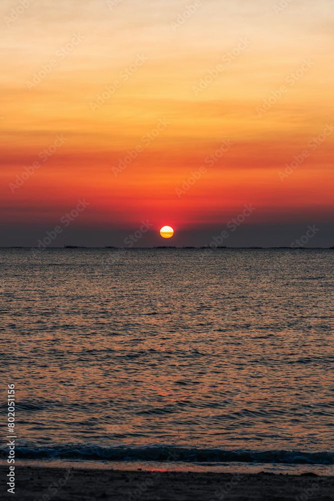 Sunset over the sea background. Big sun over the sea with beautiful natural light at sunset or sunrise. Sunset over the sea background. Big sun over the sea with beautiful natural light at sunset or sunrise.