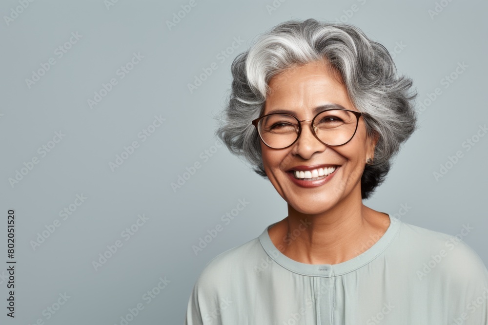 Portrait of a smiling senior woman of Indian ethnicity Portrait of a smiling senior woman of Indian ethnicity