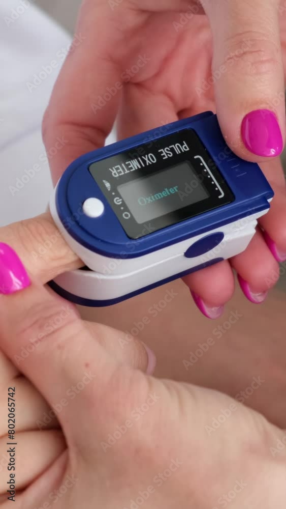 Mom is measuring little child oxygen saturation. Home monitoring, medicine test for blood oxygen saturation during illness. Vertical video. Mom is measuring little child oxygen saturation. Home monitoring, medicine test for blood oxygen saturation during illness. Vertical video.