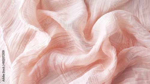 Crinkled linen in a delicate shade of blush pink adds a subtle and elegant texture to any design
